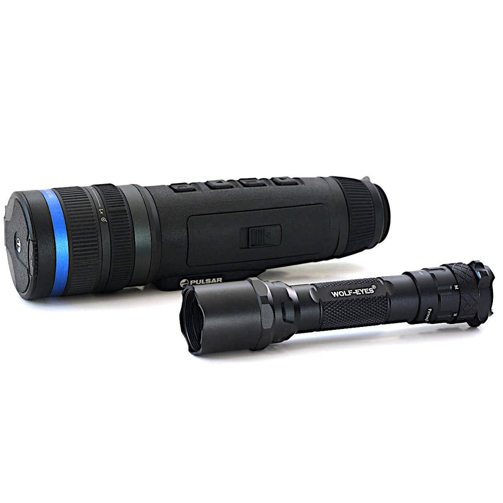 Pulsar Telos XG50 thermal monocular next to Wolf Eyes flashlight, showcasing compact design and accessory compatibility.