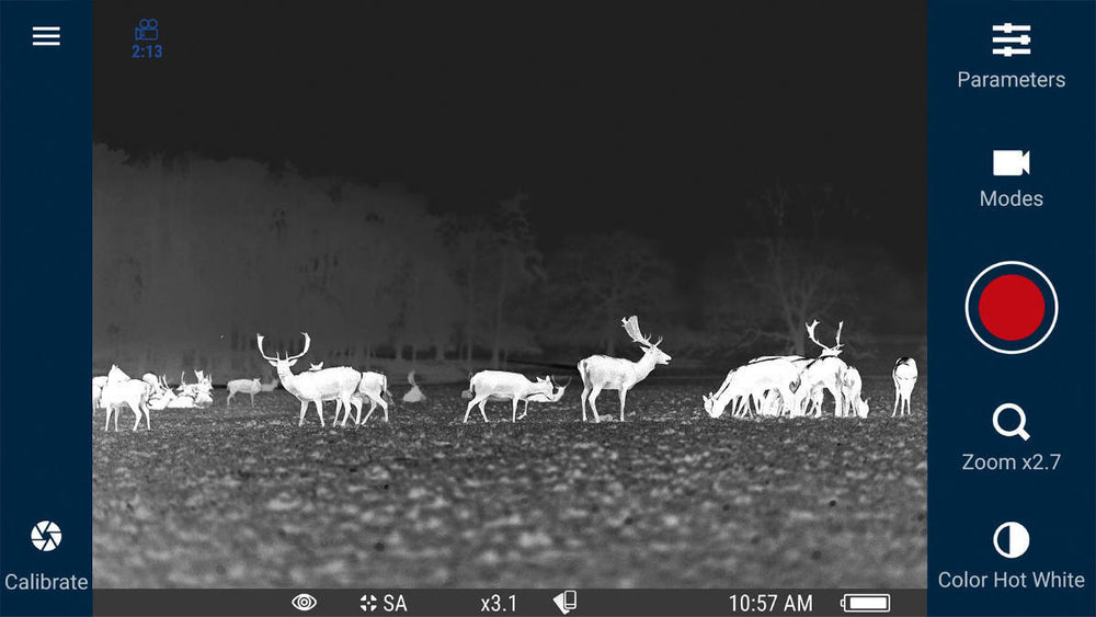 Thermal imaging view of deer herd using Stream Vision App with Pulsar scope, showing zoom and color mode options on screen.