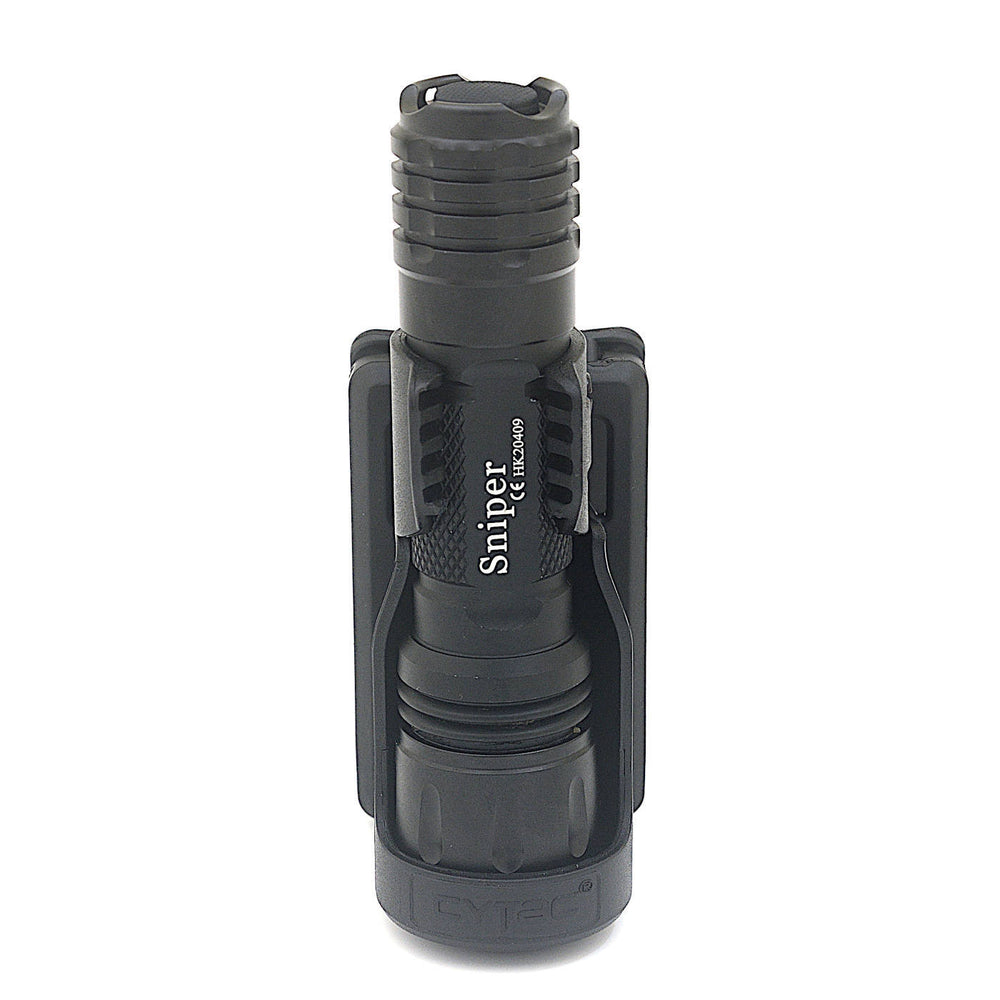 Compact Sn1per torch mounted in Tactical Polymer Holster, showcasing tight fit and durable polymer construction.
