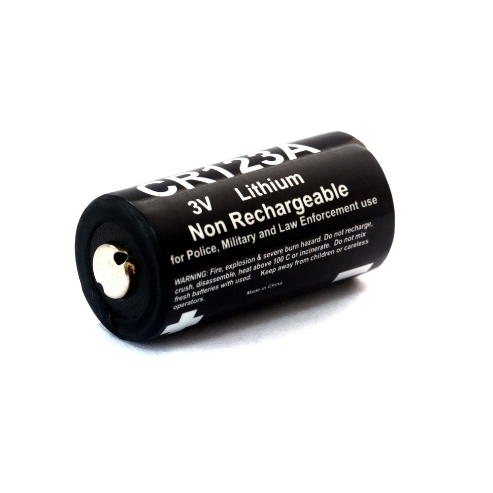 CR123A Kolt Battery Pack close-up of lithium cell with safety warning. 3V non-rechargeable battery for tactical and industrial use.