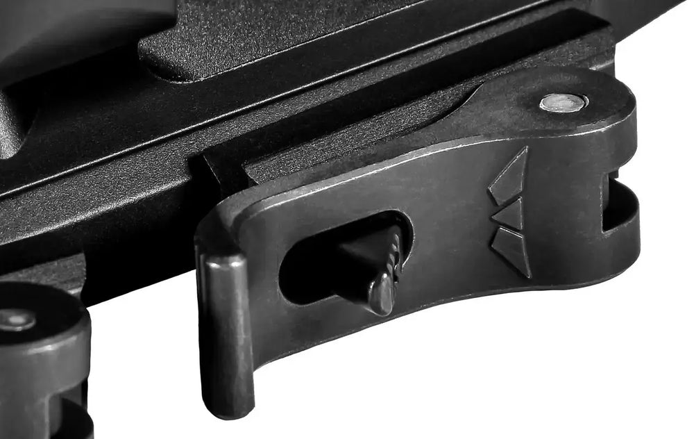 Close-up of Warne QD XSKEL 30mm mount lever mechanism, showcasing quick-detach functionality and precision machining.