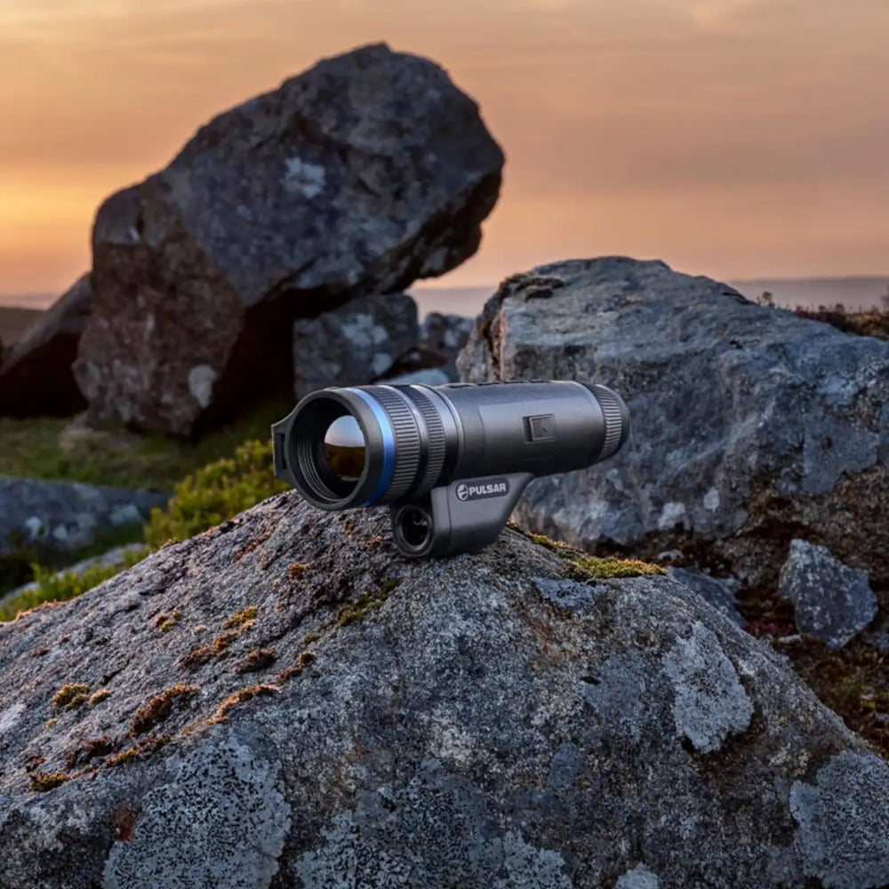 Telos LRF thermal monocular on rocky outcrop
