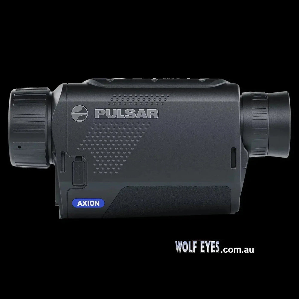 Side view of Pulsar Axion XQ30 Pro thermal monocular featuring durable build, AXION branding, and compact design for easy portability.